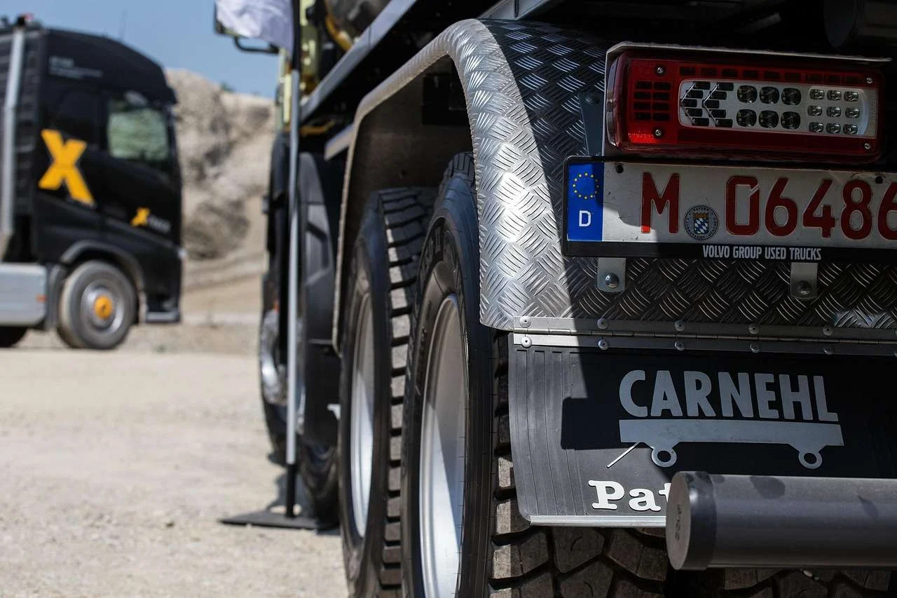 Volvo truck carrying a load, one of the HGVs covered by truck finance