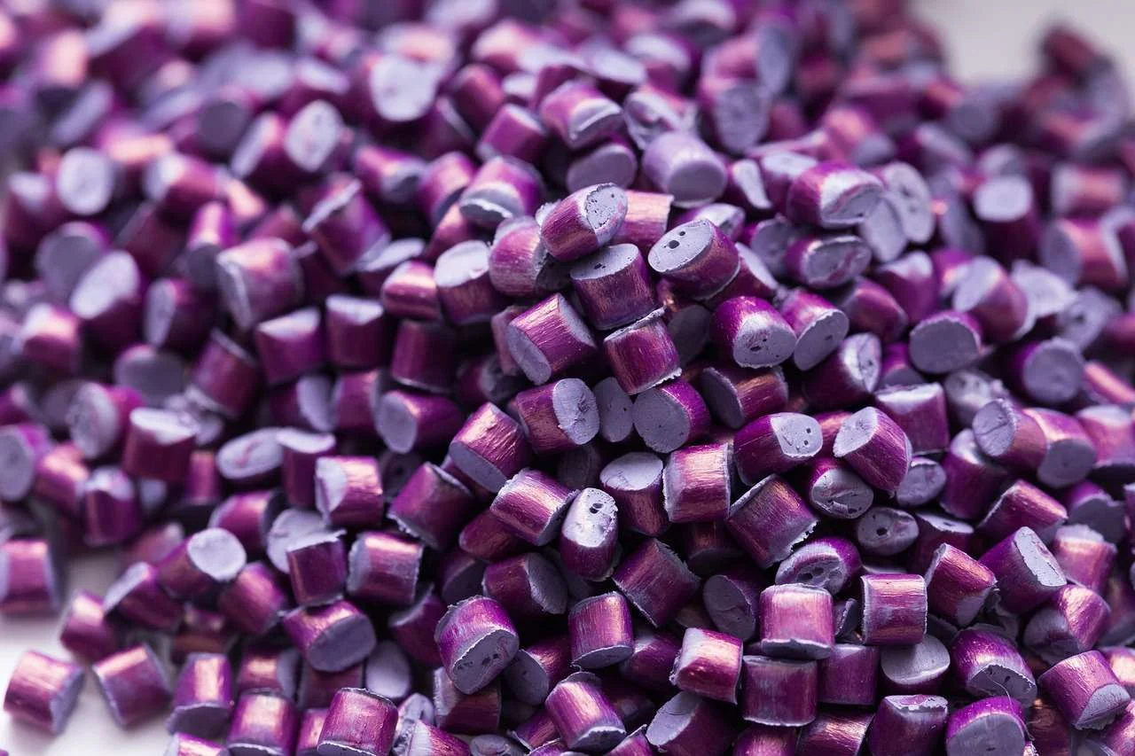 Plastic regrind produced by a granulator, recycled back into production