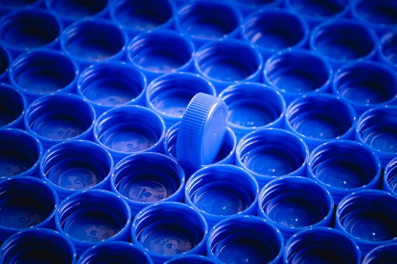 Rows of blow-moulded plastic bottles with caps