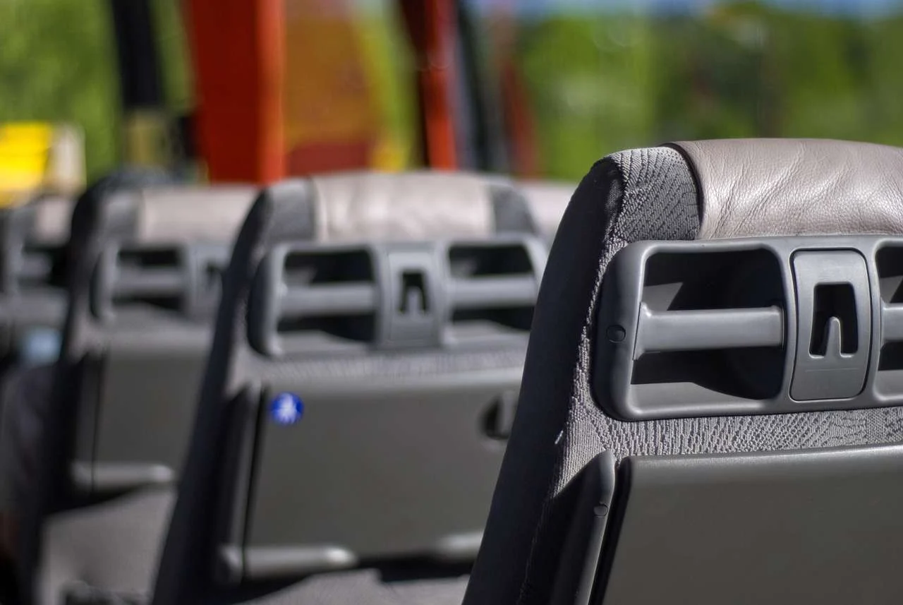 Volvo buses in city traffic, passenger vehicles covered by transport finance