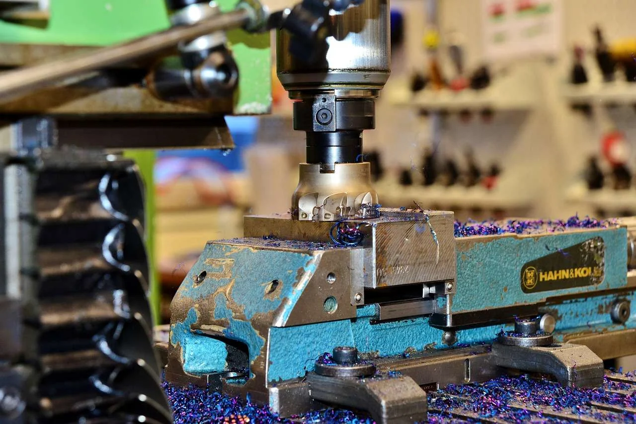Workpiece held in a vice on a milling machine in an engineering workshop
