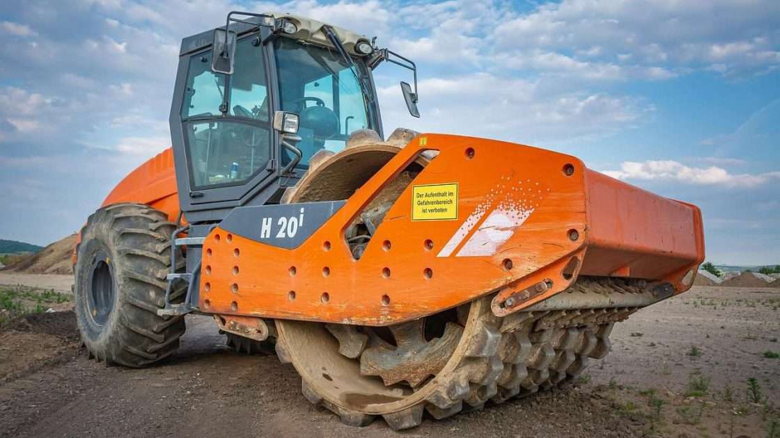 Road roller compacting ground on a civil engineering site