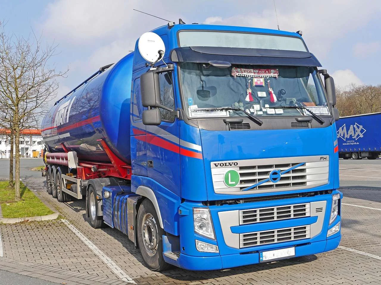Tractor unit and tanker trailer parked at a truck stop, a trailer type funded on hire purchase