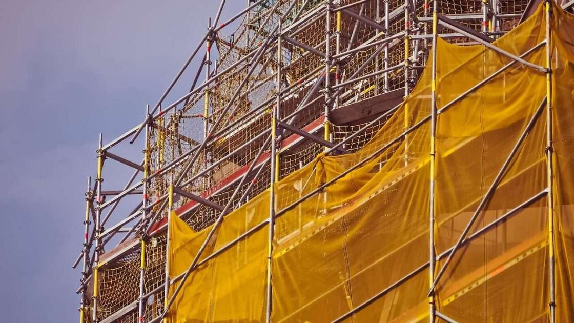 Scaffolding erected around a church facade for restoration work