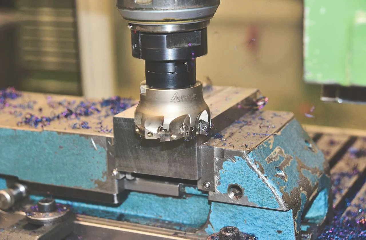 Milling cutters and metal shavings on a CNC milling machine