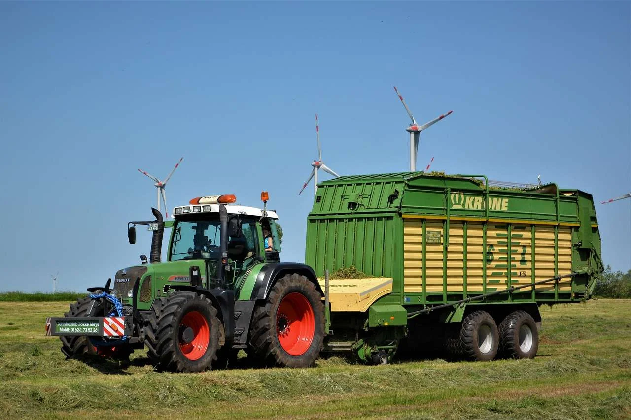 Tractor working a silage clamp in a farm yard