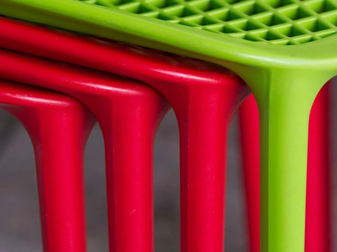 Stacked plastic chairs, a typical product of a plastic injection moulding machine