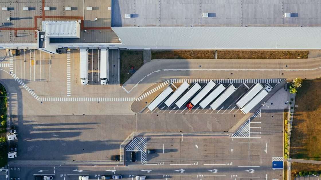 Aerial view of HGV trailers at the loading bays of a distribution centre