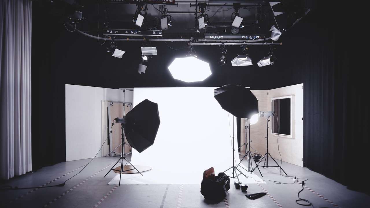 Professional photography studio with flash heads and lighting stands
