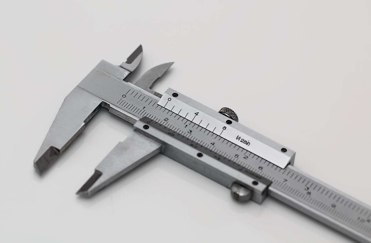 Vernier caliper measuring a precision engineered part