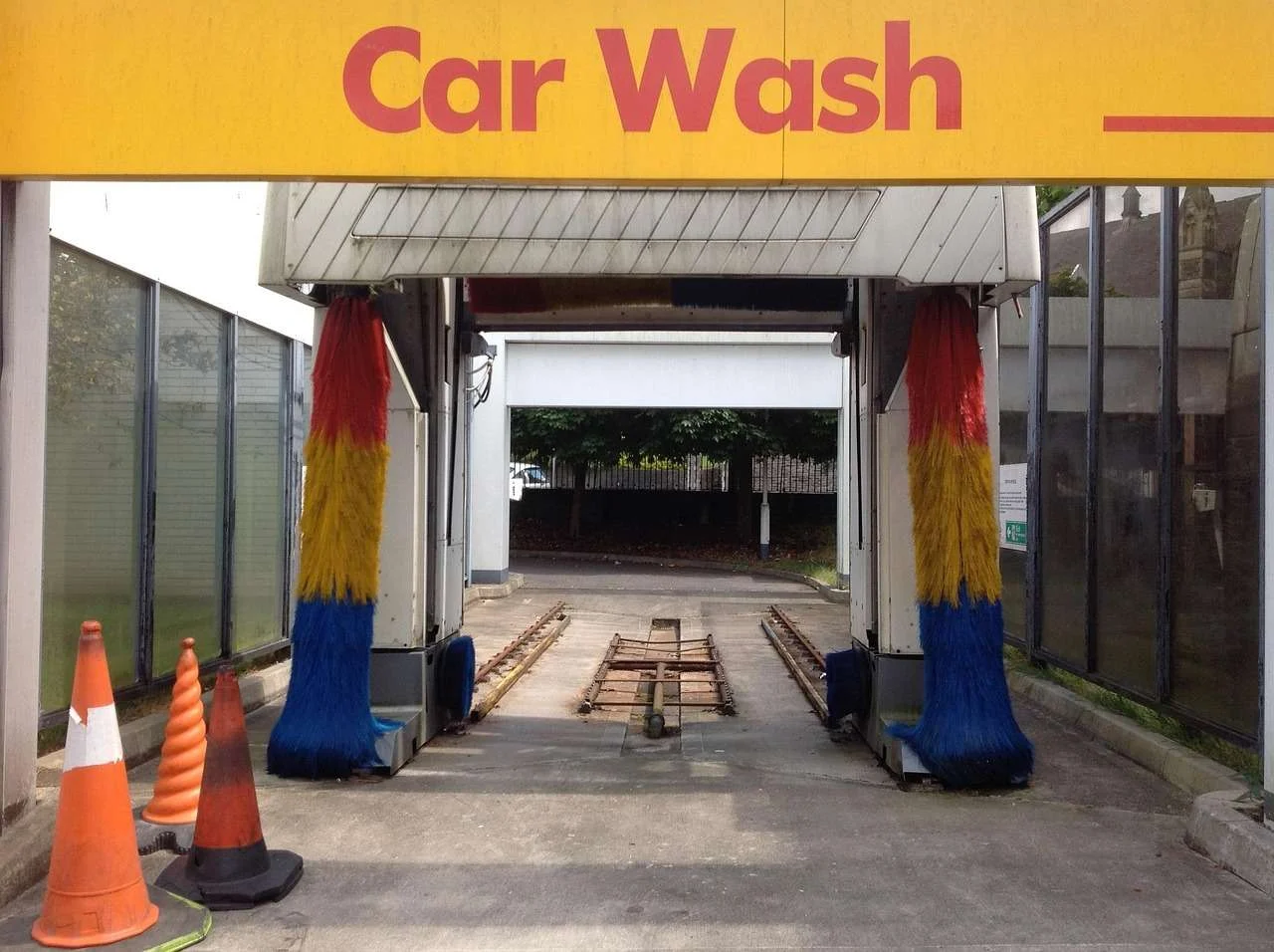 Brushes of a rollover car wash gantry on a garage forecourt