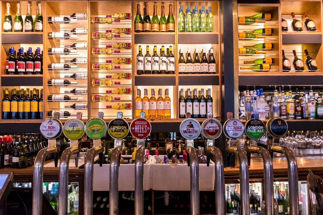 Pub bar with beer taps and spirits on the back bar
