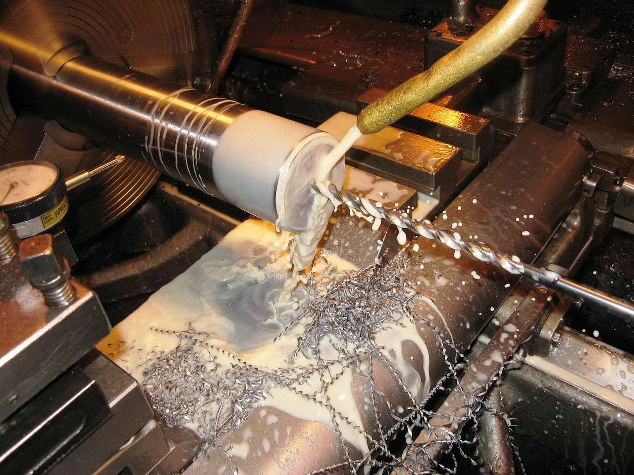 Cutting tool machining a part on an engineering lathe