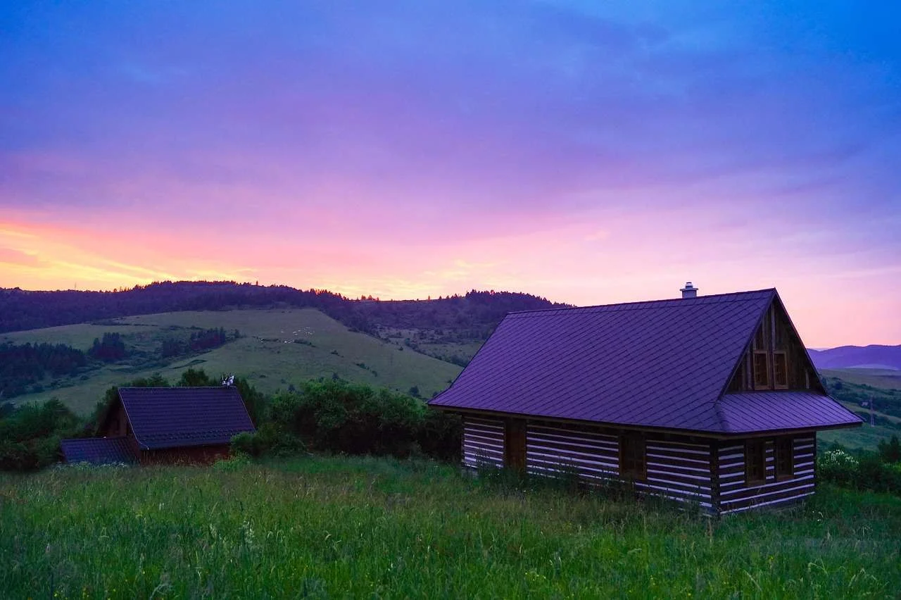 Timber holiday lodge in the countryside at sunset