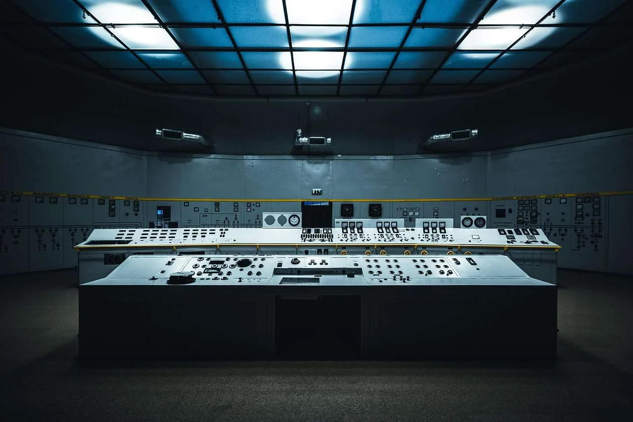 Broadcast control room with monitors and control panels