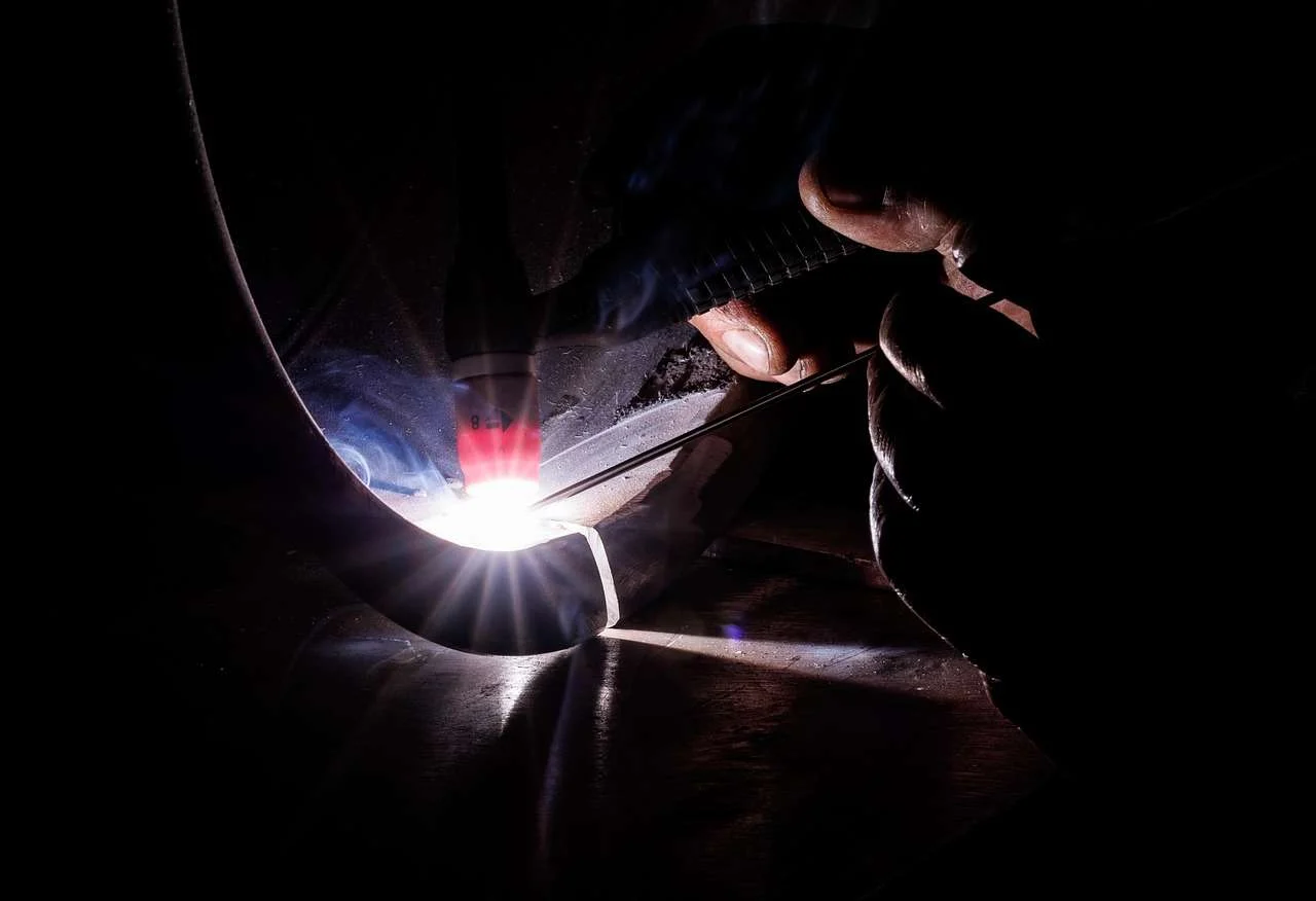 TIG weld being made on a metal component, the type of joint checked by NDT