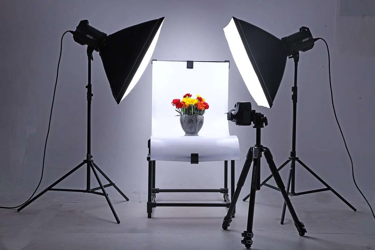 Product photography set-up with camera on tripod and studio lights