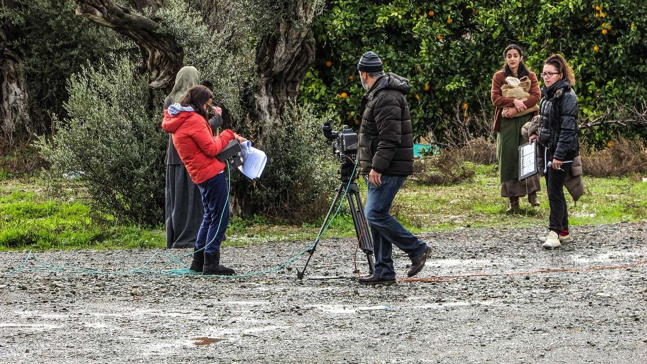 Film crew operating a cinema camera on set