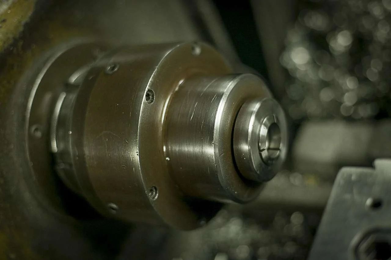 Steel bar held in a lathe chuck