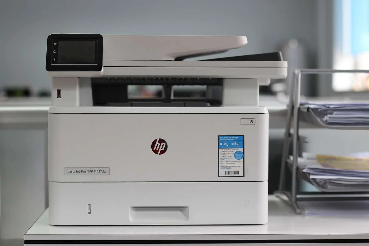Multifunction office printer and copier with paper output tray