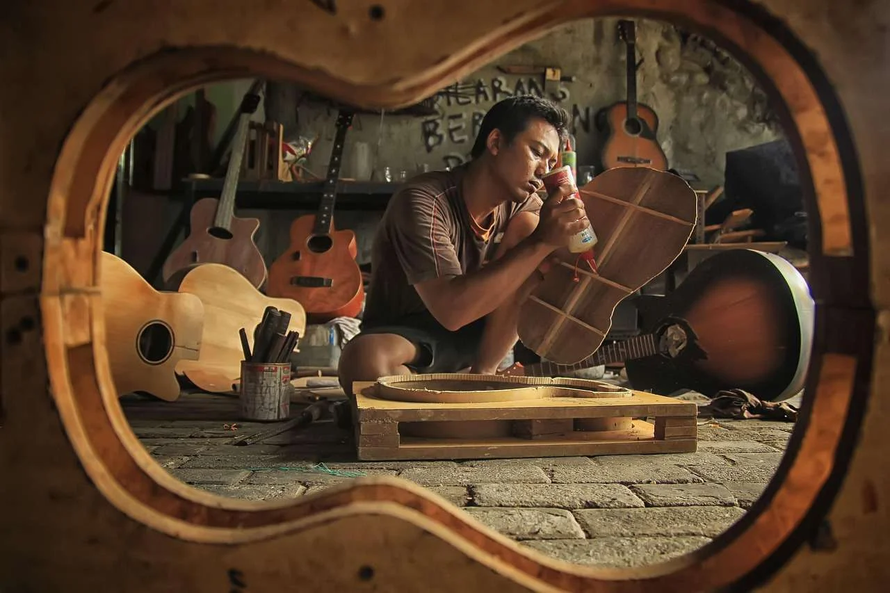 Craftsman working at a bench in a woodworking workshop