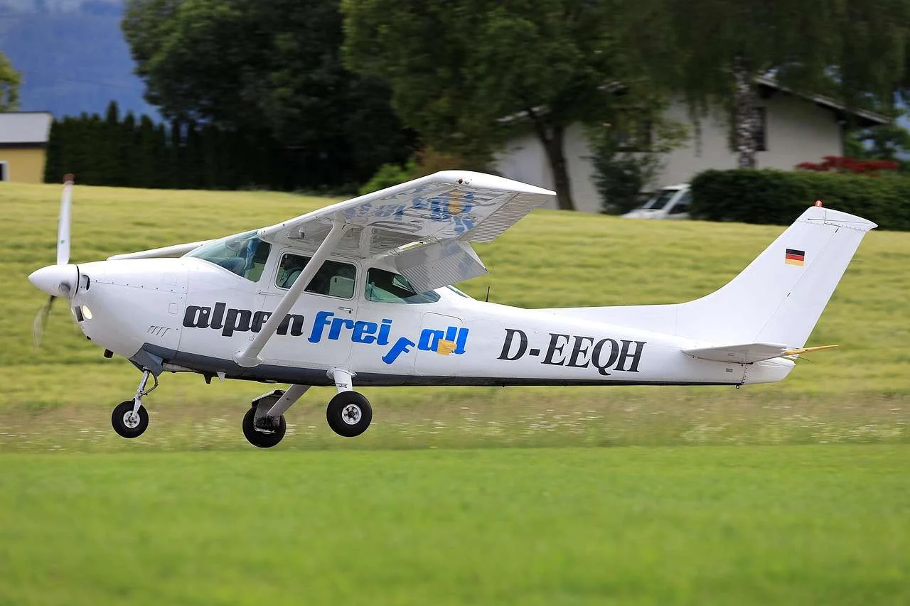 Light training aircraft taxiing at a grass airfield