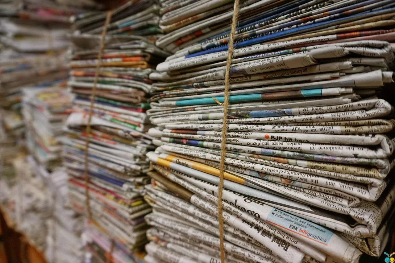 Bundled waste paper tied for recycling, the kind of material a baler compresses for sale