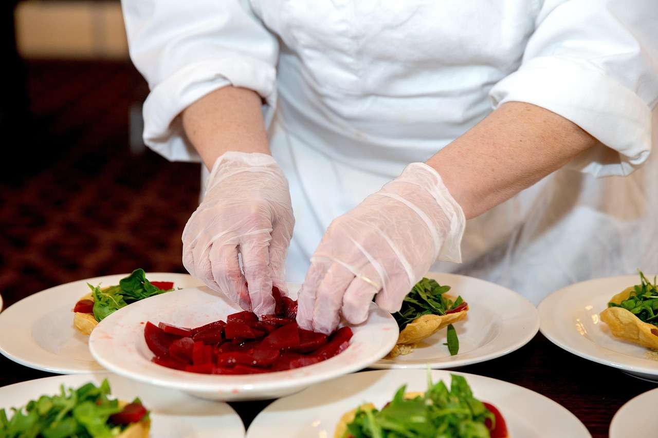 Chefs preparing dishes in a busy commercial kitchen
